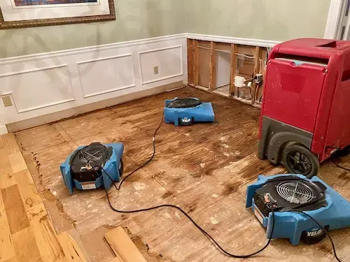 Drying machines running in the room of a Brentwood home after a leak