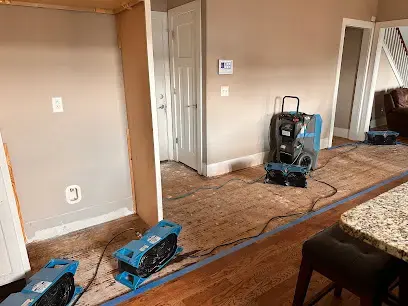 Drying equipment set up in a room with wet flooring in a Smyrna home